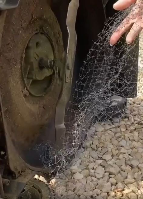 Erosion prevention netting caught in a lawn-mower.