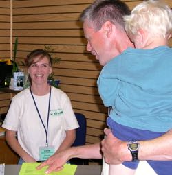 Dawn Fleming assists guests during Marine Science Day at VIMS. 