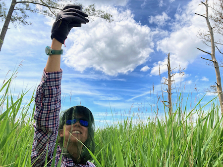 PhD student Grace Molino measures the sunlight available to plant life. © Alex Smith.