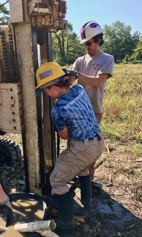 W&M undergrad Grace Weeks ’23 (front) helps VIMS professor Chris Hein extract a sediment core during geologic research on the barrier islands of Virginia's Eastern Shore.