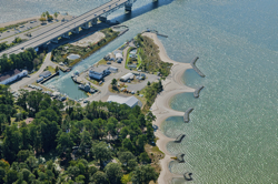 These breakwaters protect the upstream side of VIMS York River shoreline. The sandy tomobolos between the rocky breakwaters have been planted in native grasses.