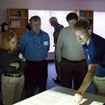 Mark Brush (right) uses a smart board projector to demo the new model. ©Janet Krenn/VASG