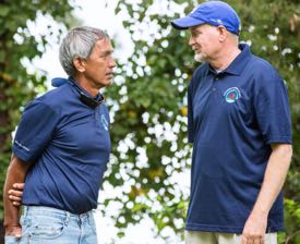 VIMS professor Kirk Havens (R) speaks with long-time friend and Pwo Navigator Nainoa Thompson. Thompson is President of the Polynesian Voyaging Society. ©J. Michael Foreman.