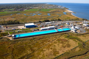 An aerial view of the Ohmsett Wave Tank. Photo courtesy of  Ohmsett – The National Oil Spill Response Research & Renewable Energy Test Facility.