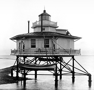 Long Shoal Reef in 1885 breaking the surface of the James River toward Mulberry Island (near Ft. Eustis). This reef was such a hazard that it was marked by a Chesapeake Bay-style screw-pile lighthouse. Photo by Major Jared A. Smith courtesy of The Mariners’ Museum, Newport News, VA